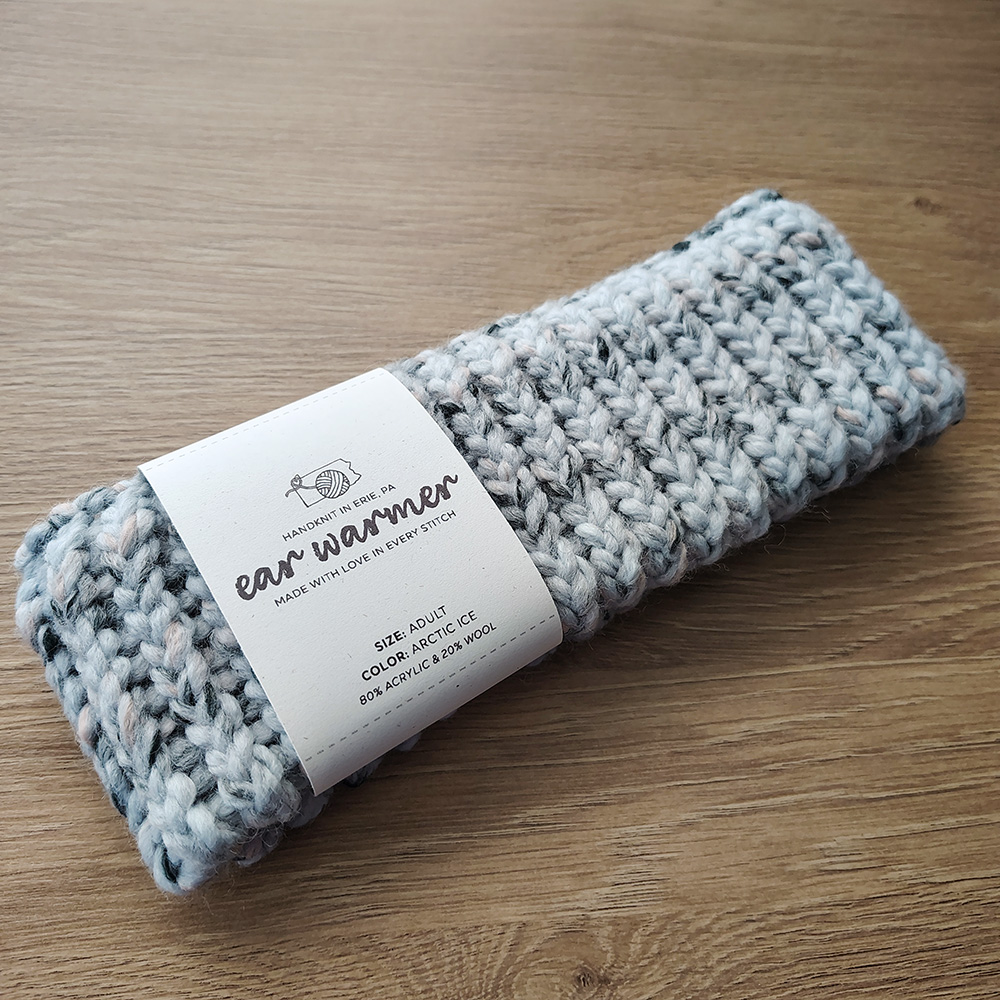 Arctic-Ice-colored Ear Warmer on Table