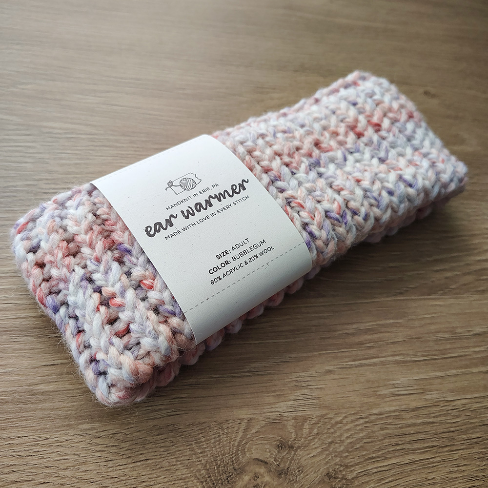 Bubblegum-colored Ear Warmer on Table