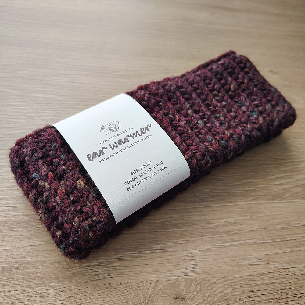 Spiced-Apple-colored ear warmer on Table
